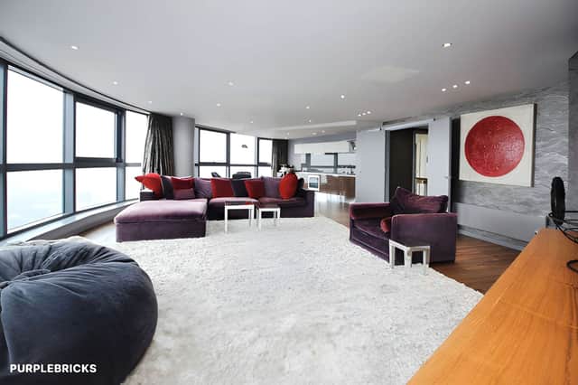 Floor-to-ceiling windows make the open-plan lounge and dining area a standout feature