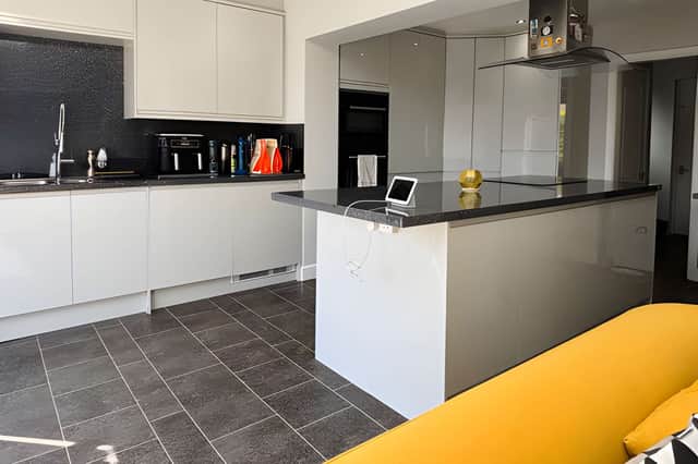 The expansive rear kitchen and dining area forms the heart of the home's open-plan arrangement