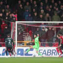 TROUBLED TIMES: Kyle Walker, left, looks on as Burnley fall behind to Lincoln City, the Clarets now on the hunt for a new manager and an ex-Leeds United favourite a frontrunner.