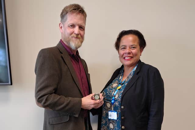 Liz's husband Rob Keat accepting the award from Michelle Bateman, Deputy Chief Nursing Officer for England