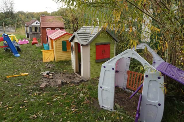 Vandals ripped the doors from children's playhouses and tore down lighting
