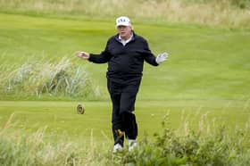 US President Donald Trump plays golf at his Trump Turnberry golf course in South Ayrshire