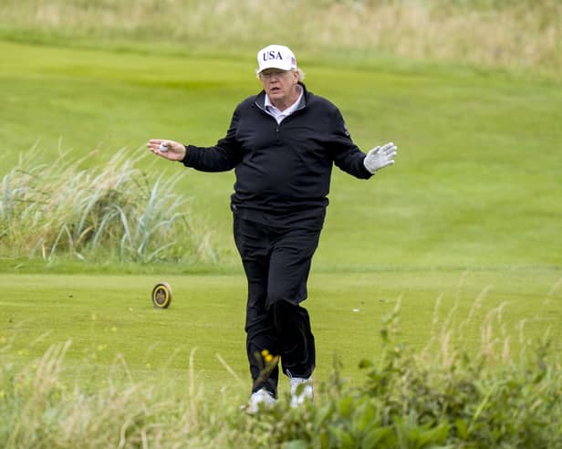 US President Donald Trump plays golf at his Trump Turnberry golf course in South Ayrshire