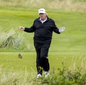 US President Donald Trump plays golf at his Trump Turnberry golf course in South Ayrshire