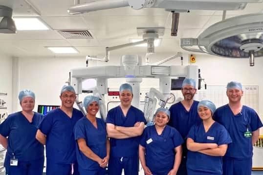 Nuffield Health Leeds Hospital's multidisciplinary theatre team with the da Vinci 5 robotic surgical system following the successful completion of the first week of robotic- assisted surgery.