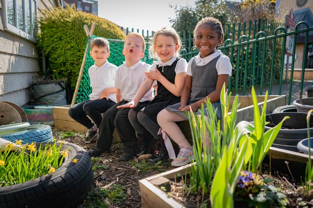 Youngsters celebrate the school report.