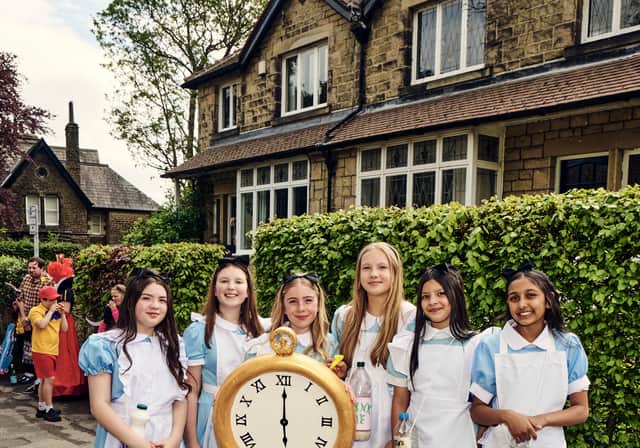 Pupils from Moorfield School and Nursery take part in the Ilkley Carnival with their Alice in Wonderland-themed float.