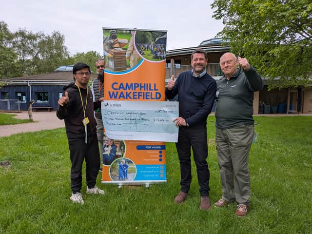 John Hudson of St Johns Masonic Lodge, presenting Cheque to Camphill special needs school Wakefield on behalf of West Riding of Yorkshire Masonic |Charities.