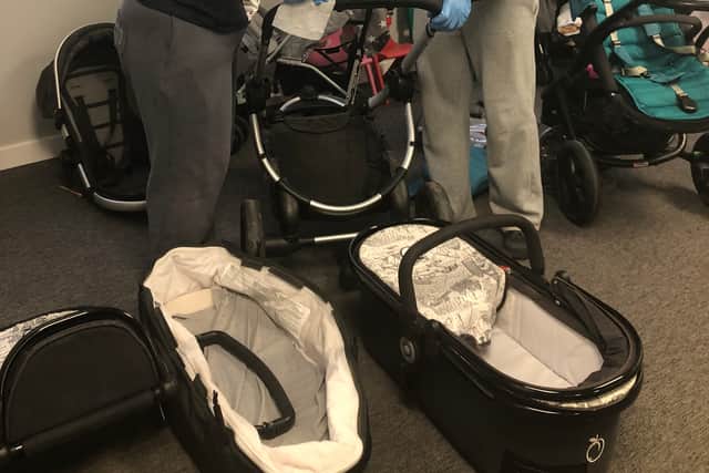 Volunteers Kelsey and Maya clean all the donated prams before they are given to families referred to Leeds Baby Bank
