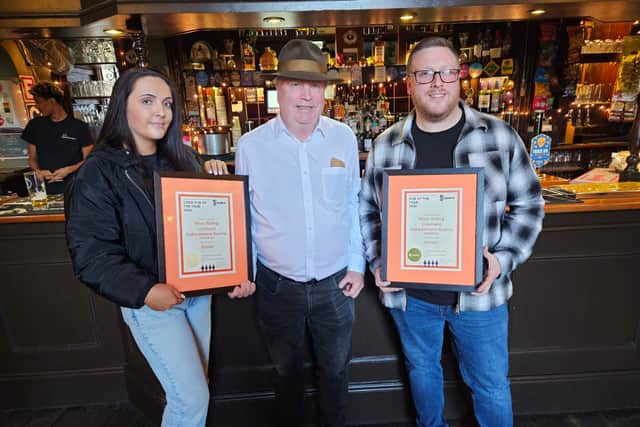Holly and Danny from the West Riding receive their awards from Mike Roebuck, Heavy Woollen branch chair