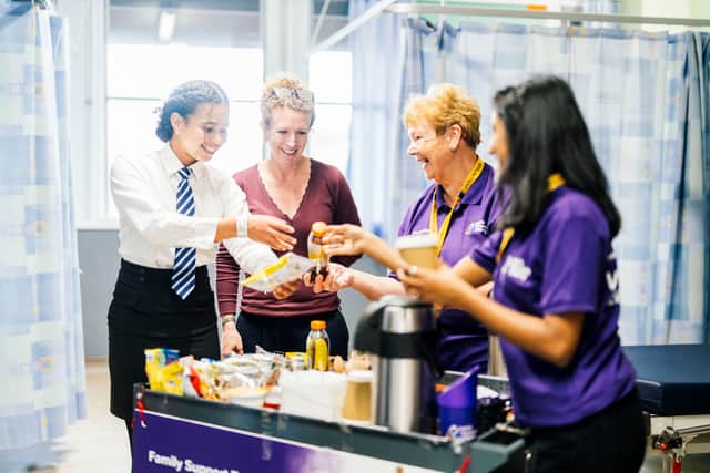 Trolley Volunteers handing out snacks and drinks on the ward.