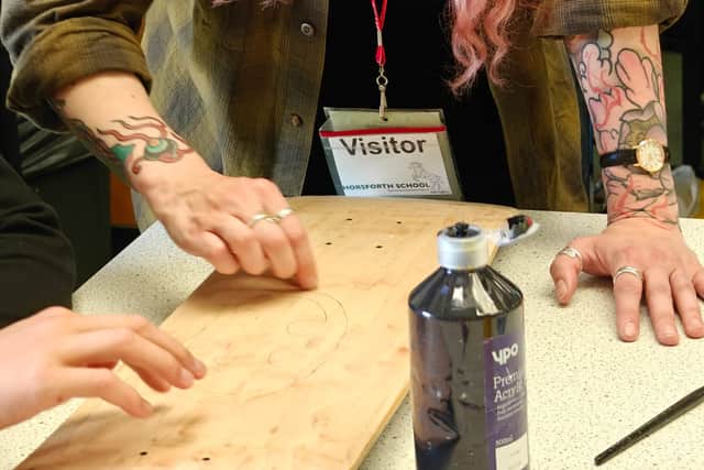 Tattoo Artist, Ellen Scott, teaches pupils at Horsforth High ow to design a skateboard