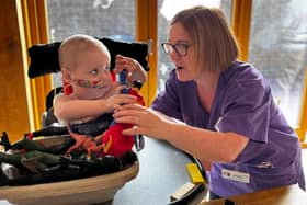 Robin interacting with a Play Specialist in hospital