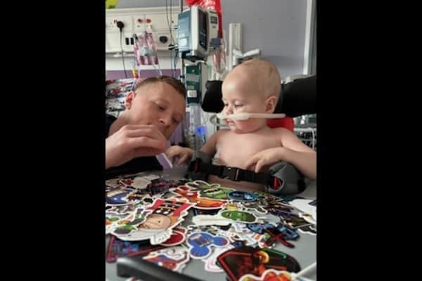 Robin and his dad Ricky in hospital