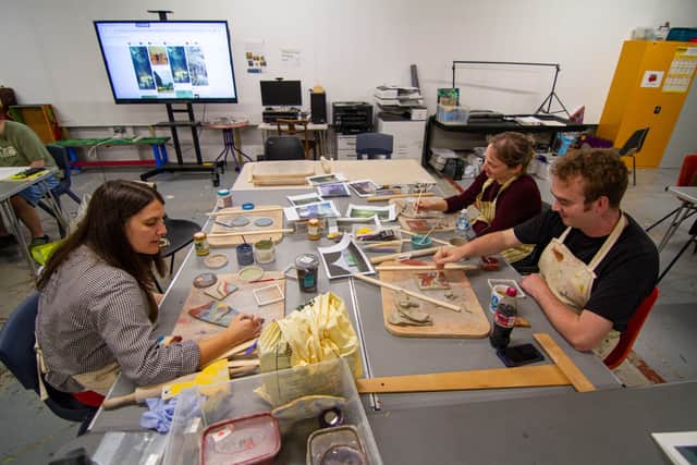 Studio Pyramid attendees work on ceramic pieces for exhibition at Leeds Art Gallery.