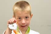 Samuel with his newly received Silver Medal