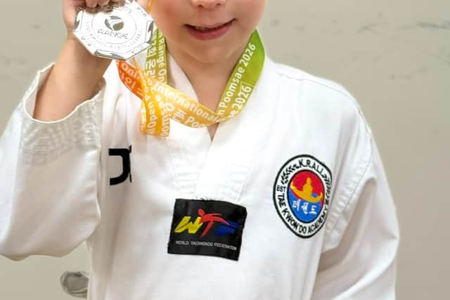 Sam with his Silver medals