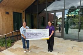 Louise presenting a cheque for £2,525 to Jessica Harrison from Leeds Hospitals Charity.