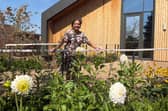 Dr Agam Jung with the dahlias in the garden of the Rob Burrow Centre for MND