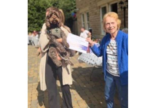 Anchor's Manor House Roundhay presents the award for the Scruffiest & Fluffiest