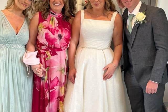 Tamla with her children Maisie, Ellie and Sam at Ellie's wedding last year 