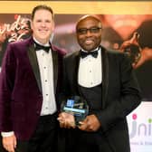 Cedric Boston (right), Unity Homes and Enterprise Chief Executive, receives the Housing Executive Award for Best Social Value Project from Paul Smith, Head of Frameworx at NHMF Frameworx.