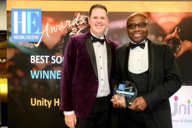 Cedric Boston (right), Unity Homes and Enterprise Chief Executive, receives the Housing Executive Award for Best Social Value Project from Paul Smith, Head of Frameworx at NHMF Frameworx.