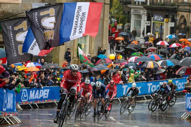 The peloton pass the pump room and climb Cornwall Road in Harrogate.