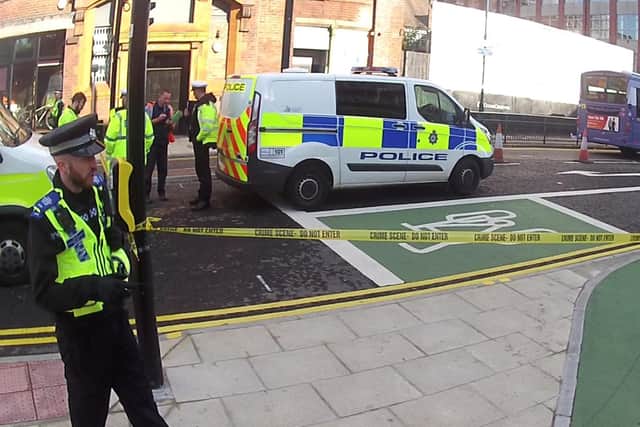 Police have closed part of York Street after a man was hit by a bus