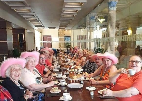 A group from HOPE enjoying  afternoon tea in the Winter Gardens, Blackpool earlier this year.