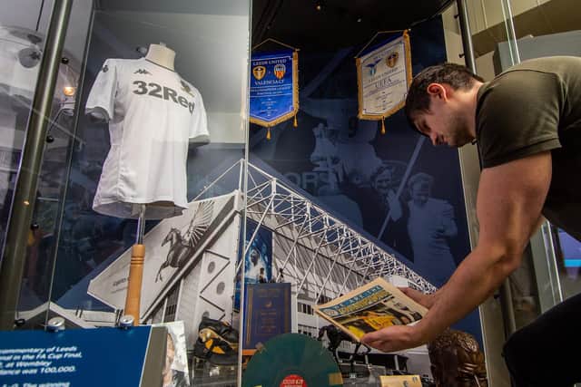 Marek Romaniszyn, assistant curator at Leeds City Museum inspects memorabilia for the exhibition. PIC: James Hardisty