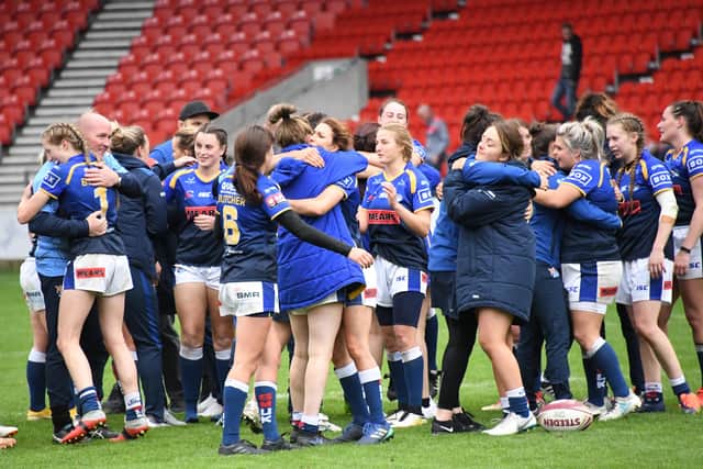 Leeds Rhinos congratulate each other on reaching the Women's Super League Grand Final following victory over St Helens. PIC: Garry Beevers