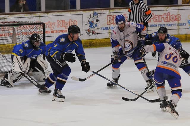 Steve Duncombe (second left) tries to block a Peterborough Phantoms shot during Sunday's 4-2 defeat Picture: David Lowndes