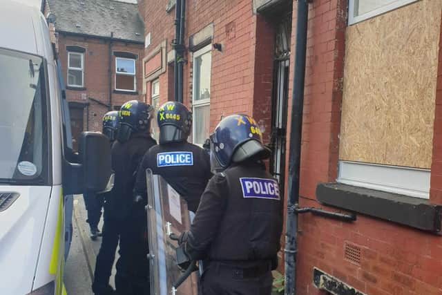Officers raiding a house in south Leeds.