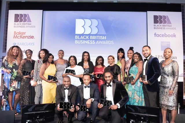 Winners of the Black British Business Awards 2019 with Sharon Watson in yellow dress. Photo by Steve Dunlop.