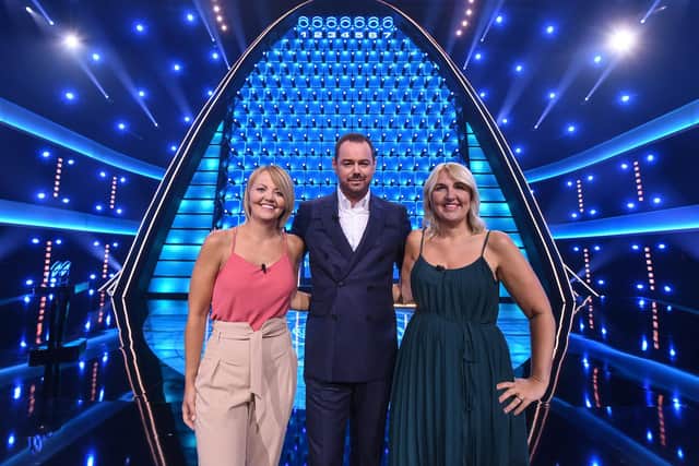 Sisters Helen McDonald and Louise Seymour, from Leeds, with The Wall host Danny Dyer. Credit: BBC.