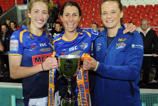 Caitlin Beevers celebrates along with Leeds Rhinos captain Courtney Hill and club captain Lois Forsell.