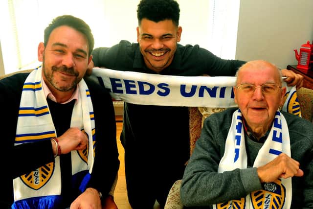 Jack Hannan 91 with his son Tony and grandson Harry giving a Leeds salute.Photo: Photo: Gary Longbottom