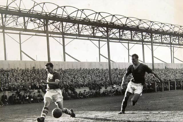 John Charles, in action in the game against Birmingham City at Elland Road soon after the fire that decimated the Main Stand in September 1956.
