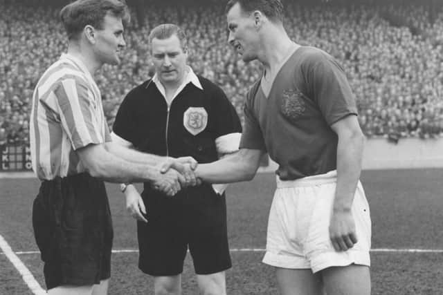 WE'LL MEET AGAIN: John Charles' last league  game at Elland Road, Easter Monday 1957. Charles shakes hands with Don Revie, Sunderland captain , before the kick-off.