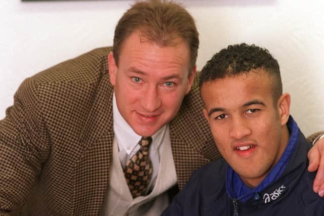 Jamie Jones-Buchanan pictured signing for Leeds RL with coach Dean Bell in 1999.
