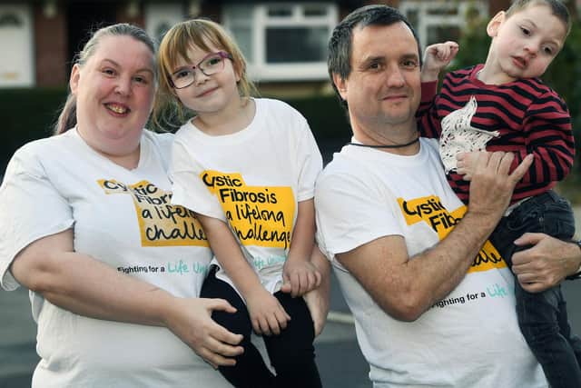 Laura and David Venner with two of their five children, 6-year-old Abbie and 3-year-old Oliver. Abbie and Oliver have cystic fibrosis.