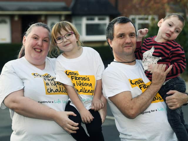 Laura and David Venner with two of their five children, 6-year-old Abbie and 3-year-old Oliver. Abbie and Oliver have cystic fibrosis.