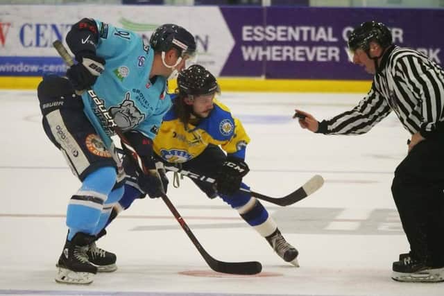 WE MEET AGAIN: Leeds Chiefs' Steven Moore prepares to face-off against Sheffield Steeldogs' Nathan Salem in last month's meeting at Ice Sheffield. Picture courtesy of Chris Stratford.