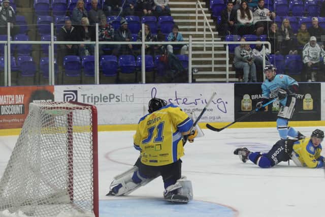 TAKE THAT: Cam Brownley gets in a shot on Leeds' netminder Sam Gospel. Picture courtesy of Cerys Molloy.