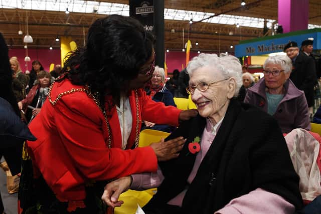 The Lord Mayor of Leeds, Coun Eileen Wilson presents the first poppy of the 2019 appeal to Joy Tomlinson, aged 100.