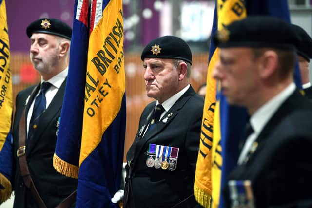 Standard bearers take part in the ceremony.