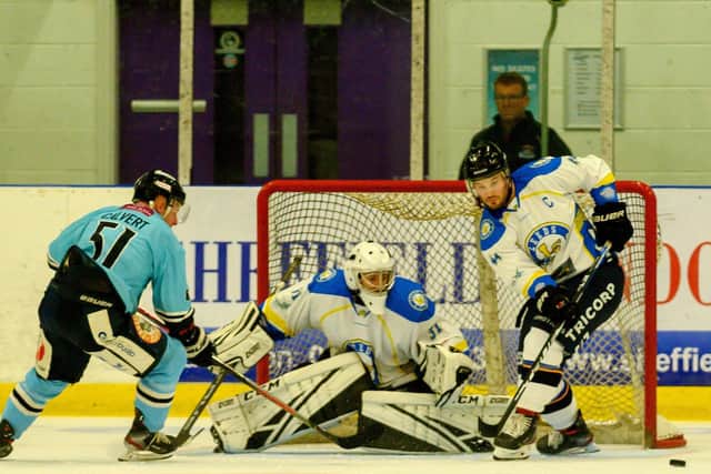 KEEP IT OUT: Sam Gospel defends the Leeds Chiefs' goal under pressure from Sheffield Steeldogs' Ashley Calvert on Friday night. Picture: Bruce Rollinson