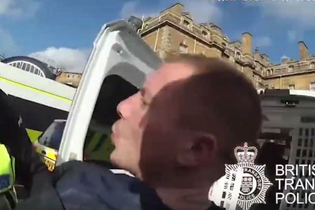 Video footage captured Glover spitting in the officer's face. Photo provided by the British Transport Police.