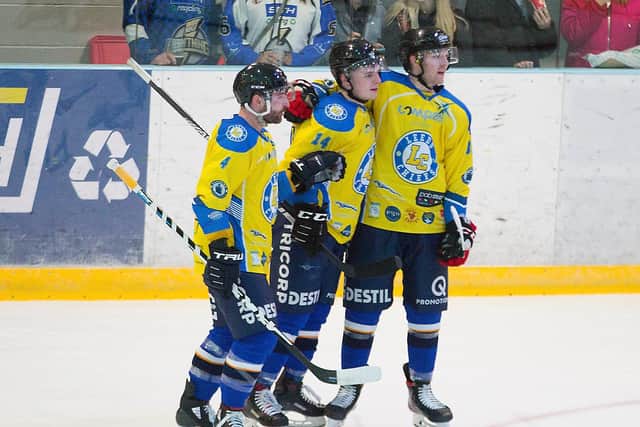 DOUBLE TROUBLE: Adam Barnes, far right, celebrates one of his two goals at Milton Keynes last Sunday with player-coach Sam Zajac, left, and Lewis Baldwin. Picture courtesy of Tony Sargent.